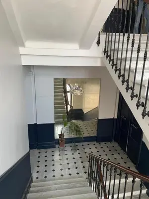 a staircase in a building with a potted plant at La Galerie 58 - Luxe & Design en centre ville in Nice