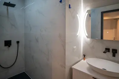 a bathroom with a sink and a mirror at GuestReady - Lovely Getaway in Nice