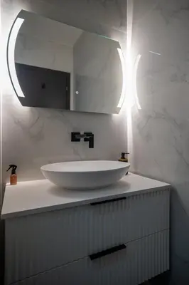 a bathroom with a white sink and a mirror at GuestReady - Lovely Getaway in Nice