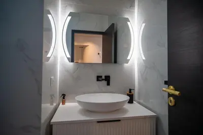 a bathroom with a white sink and a mirror at GuestReady - Lovely Getaway in Nice