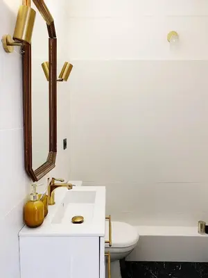 a white bathroom with a sink and a mirror at Studio Carré Or - Centre Nice 2m à pied de la mer in Nice