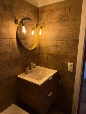 a bathroom with a sink and a mirror at Elégant studio de 25m2 in Saint-Laurent-du-Var