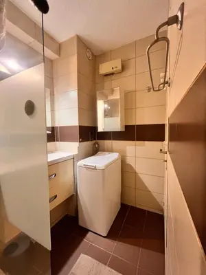 a small bathroom with a toilet and a shower at Heliotel Marine Studio 30m2 très lumineux avec terrasse 17m2 au 3eme étage in Saint-Laurent-du-Var