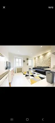 a room with a kitchen and a living room at Joli appartement centre de Nice in Nice