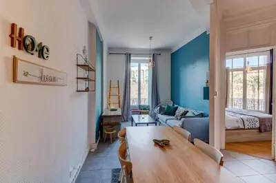 a living room with a table and a couch at Lovely 2 bedroom Apartment in Nice with Balcony in Nice