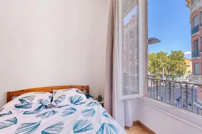 a bedroom with a bed and a window at Lovely 2 bedroom Apartment in Nice with Balcony in Nice