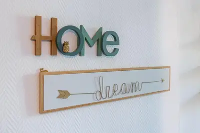 a sign that says hmc on a wall with the word dream at Lovely 2 bedroom Apartment in Nice with Balcony in Nice