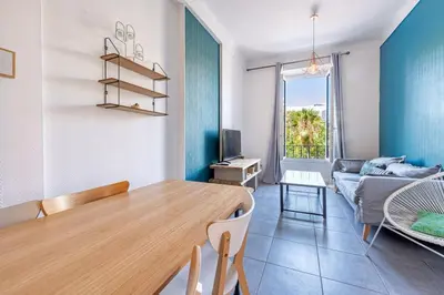 a living room with a table and a couch at Lovely 2 bedroom Apartment in Nice with Balcony in Nice