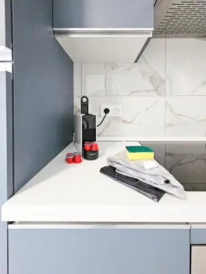 a kitchen with a white counter top with a appliance at New Big Flat 8 Pers AC WiFi in Nice