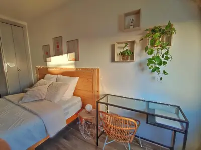 a bedroom with a bed and a glass table at Chambre à 3 min de la Promenade des Anglais à pieds 200m in Nice