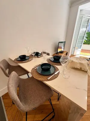 a dining room table with wine glasses on it at Luxury Central Condo with Private Terrace in Nice in Nice