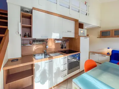 a kitchen with white cabinets and a sink at Barralis Hyper Center 2 Pers AC WiFi in Nice
