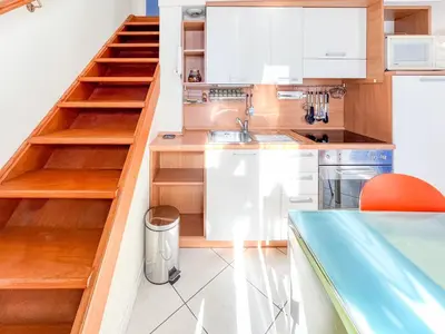 a kitchen with wooden shelves and a sink at Barralis Hyper Center 2 Pers AC WiFi in Nice