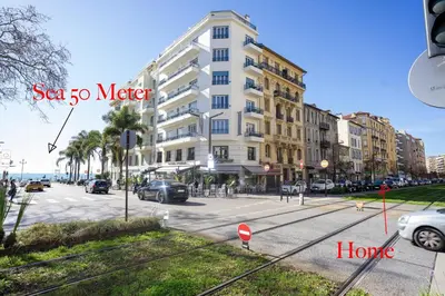 a street with a building and cars parked on the street at Palais Magnan 4 Pers WiFi AC in Nice
