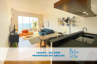 a living room with a view of the ocean at Paradise 4 Pers Vista Mare Wifi AC in Nice