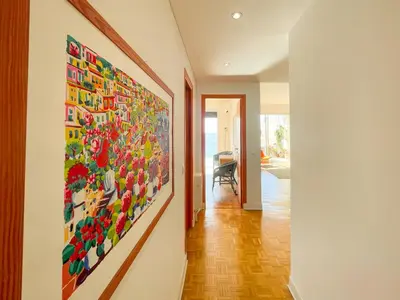 a hallway with a large painting on the wall at Paradise 4 Pers Vista Mare Wifi AC in Nice