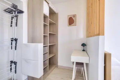 a room with a desk and a closet at Lovely 1 BR Flat in the heart of Nice in Nice