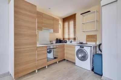 a kitchen with a washing machine and a washer at Lovely 1 BR Flat in the heart of Nice in Nice