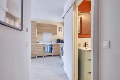 a small kitchen with a washer and dryer at Lovely 1 BR Flat in the heart of Nice in Nice