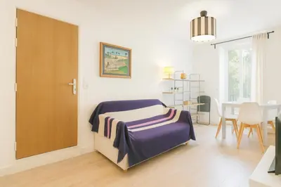 a bedroom with a bed and a dining room at Cassini 2 Pers Hyper Center WiFi in Nice