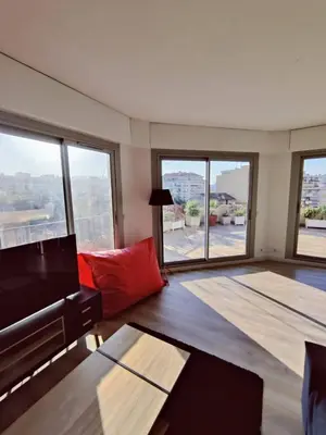 a bedroom with a bed and a large window at Romantic 1BR Escape with Sun-Rooftop Terrace in Nice