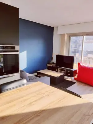 a large bed in a room with a window at Romantic 1BR Escape with Sun-Rooftop Terrace in Nice