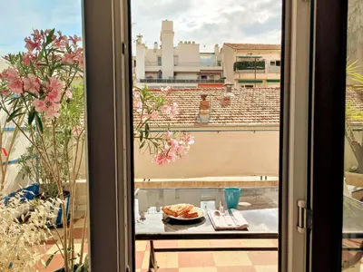 a view from a window of a table with a bowl of food at Studio with large terrace sea view 4th floor in Nice