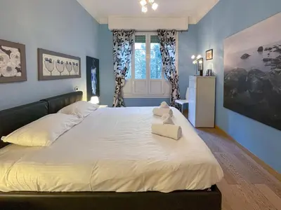 a bedroom with a large bed with a teddy bear on it at Comte De Nice 4Pers Parking Available WiFi AC in Nice