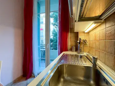 a kitchen with a sink and a window at Comte De Nice 4Pers Parking Available WiFi AC in Nice