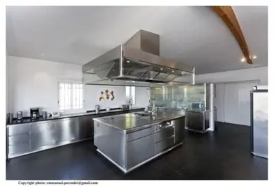a large kitchen with stainless steel appliances at MONT BORON - NICE - Splendide villa d'architecte vue panoramique in Nice