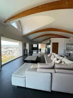 a living room with a white couch and a large window at MONT BORON - NICE - Splendide villa d'architecte vue panoramique in Nice