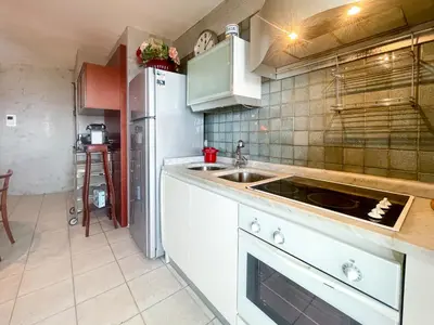 a kitchen with a sink and a refrigerator at La Dolce Vita 6 Pers Parcheggio Terrazza in Nice