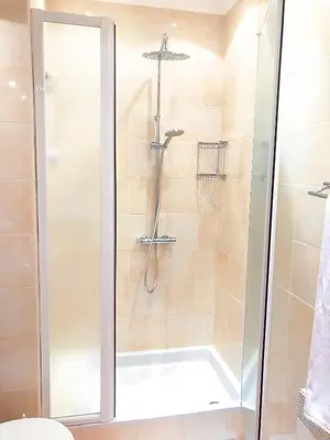 a shower with a glass door in a bathroom at Promenade 2 Pers Vista Mare WiFi AC in Nice