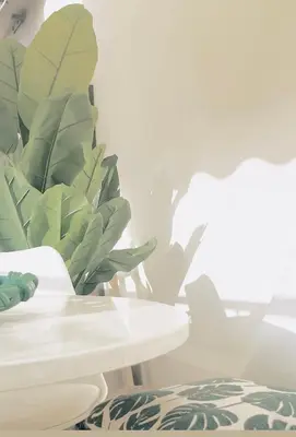 a plant sitting on a table next to a white table at Penthouse avec terrasses panoramiques in Nice