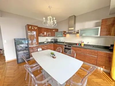 a kitchen with a white table and chairs at Cosy Cariatides Condo Promenade in Nice