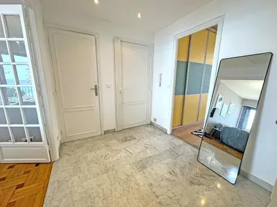 a mirror in the middle of a room at Cosy Cariatides Condo Promenade in Nice