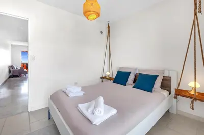 a bedroom with a bed with towels on it at Bel appartement vue mer proche de la promenade des anglais in Nice