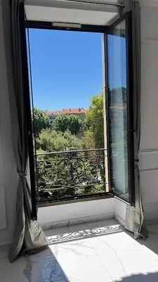 a window with a view of a balcony at Le Félix in Nice