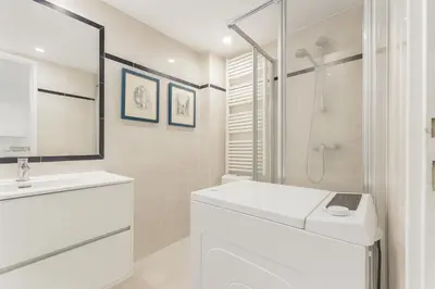 a white bathroom with a toilet and a shower at Massena 4 Pers Super Centrale WiFi AC in Nice