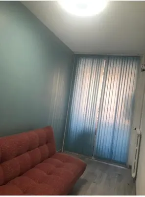 a living room with a couch and a window at Nice promenade des anglais vue mer in Nice