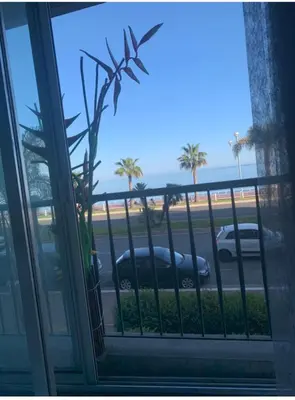 a window with a view of a parking lot at Nice promenade des anglais vue mer in Nice