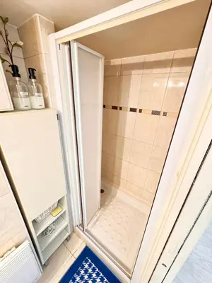 a walk in shower in a small bathroom at Tranquil Studio with Mezzanine in Carre dOr in Nice