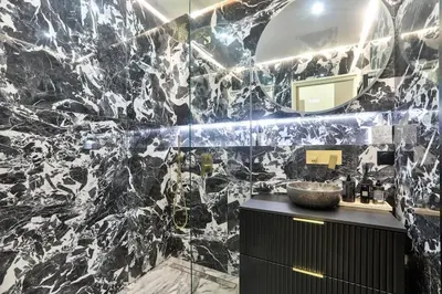 a bathroom with a black and white marble wall at #6 1BDR Buffa 2 min from the beach and Negresco,central AC Balcony in Nice