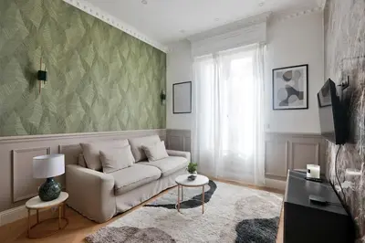 a living room with a couch and a tv at #6 1BDR Buffa 2 min from the beach and Negresco,central AC Balcony in Nice