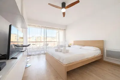 a bedroom with a bed and a ceiling fan at Smolett 2 Pers Terrazza WiFi in Nice