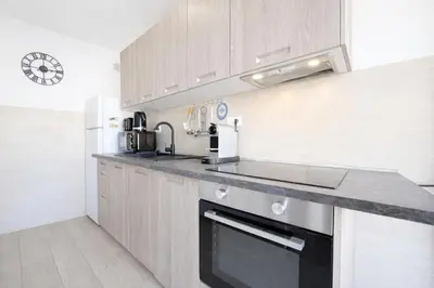 a kitchen with a sink and a stove top oven at Smolett 2 Pers Terrazza WiFi in Nice