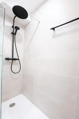a bathroom with a shower with a glass door at Smolett 2 Pers Terrazza WiFi in Nice