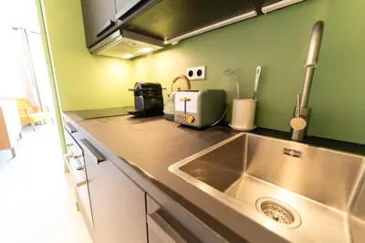 a kitchen with a sink and a counter top at Old Town Diamond, adorable sunny apartment with AC in Nice