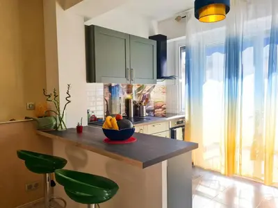 a kitchen with a bowl of fruit on a counter at Charmant appartement - Climatisation - Nice in Nice