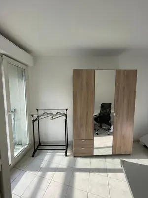 a mirror in a room with a desk and a chair at Le soleil Niçois, proche du port in Nice
